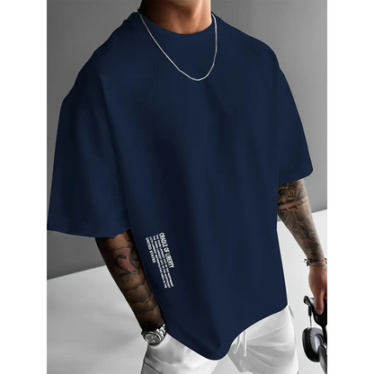 👕 53% הנחה עכשיו! ✨ חולצה לגברים עם שרוולים קצרים גזרה רחבה – תערובת כותנה פרימיום, הדפס גרפי אורבני וסגנון קז'ואל גדול במיוחד🏙️